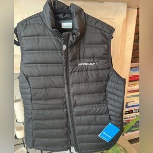 Brand new Women’s black Columbia puffer vest with Amstel Light logo!
